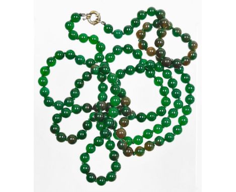 A string of jade coloured glass beads, each approx 4mm diameter, on a plain clasp, 116cm long.