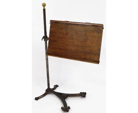 A late 19thC artist's folio stand, with oak tray board, on a metal rococo scroll base, with brass finial, 103cm high x 70cm w