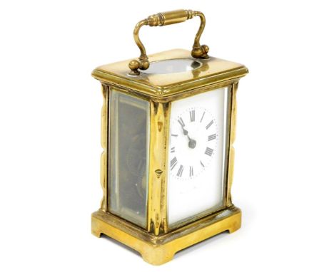 A gilt brass carriage clock, with time piece movement and enamel dial, 11cm high excluding handle. (AF)
