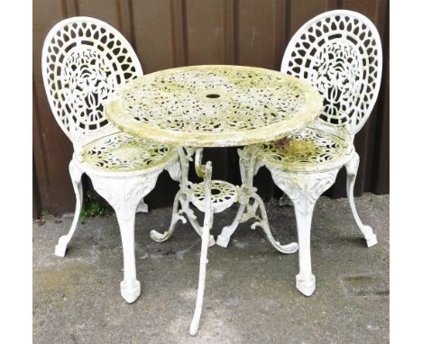 A painted white metal garden bistro set, comprising table and two chairs.