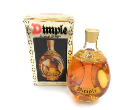 A Dimple Scotch whisky decanter, in presentation box, full.