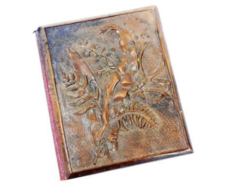 A mid 19thC blotter pad, with a wooden cover having carved foliage designs and inscribed received by Augusta Pearson 1858 for