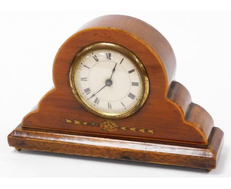 An Edwardian walnut and marquetry inlaid mantel clock, the cream circular dial with Roman numeral numbering, and a brass surr