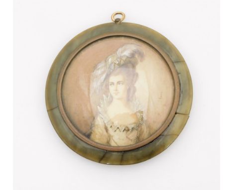 An early 19thC portrait miniature of a lady, elaborately dressed with evening gown, hat and jewellery, painted and signed Bon