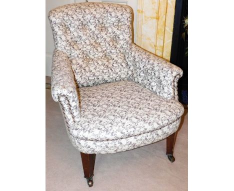 A Regency rosewood armchair, with cream floral button back upholstery, on castors, 74cm high, 70cm wide, 60cm deep. 