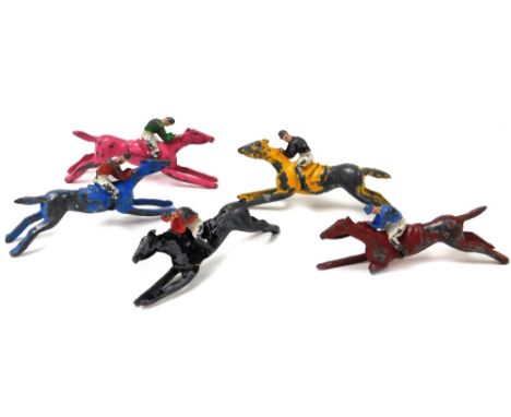 Five lead Chad Valley Totopoly jockey and horse figures, painted but play worn, 9cm wide. (5)