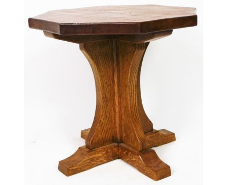 A Mouseman (Robert Thompson of Kilburn) style octagonal table, on inverted stem and platform feet, lacking mouse, 48cm high, 