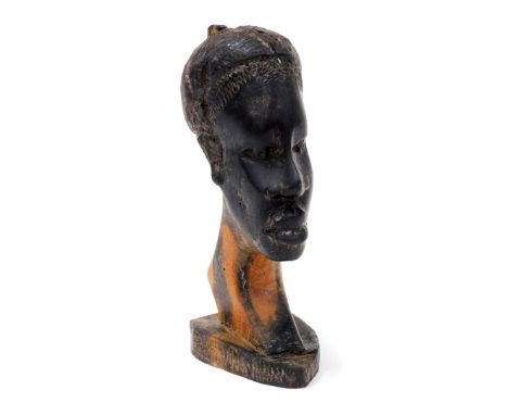 Tribal Art. A wooden figure of a African gentleman, possibly late 20thC, 15cm high. 