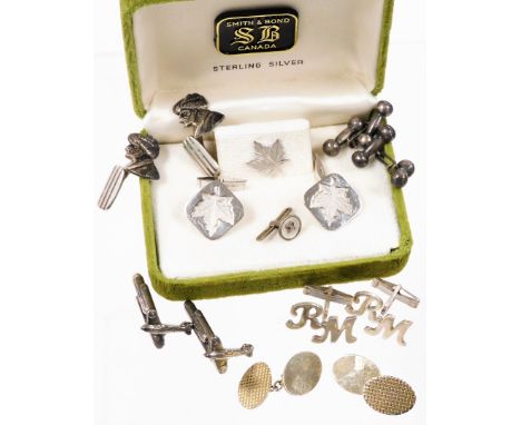 A group of silver and other cufflinks, comprising a pair of Arab figure cufflinks stamped 900, a pair of Canadian flag silver