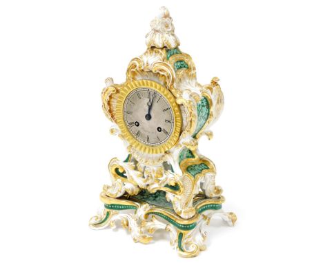 A 19thC French porcelain mantel clock, of scrolling rococo form with green floral panels within gilt scrolling framework, sil