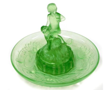 An Art Deco green glass bowl and centrepiece, the centrepiece with two children, with a lily design bowl, comprising three pi