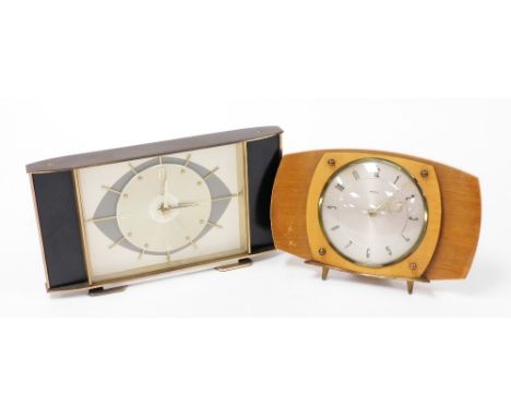 Two Metamec Art Deco mantel clocks, one in black wooden design with chrome finish face, the other in oak, with a circular dia