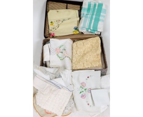 A group of linen and lace, to include doilies, tablecloths, napkins, some with floral knitting, a bright flower design tablec