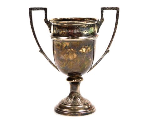 A George V silver two handled prize cup, 15cm high, Sheffield 1910, inscribed 'The Bell Efficiency Cup' relating to 'The Brit