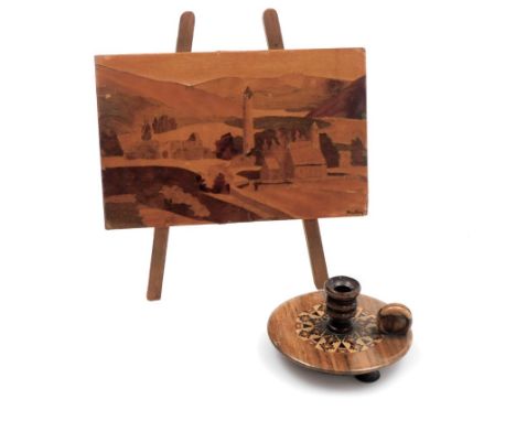 Two items of treen, to include a Tunbridge ware miniature candle stand, 7.5cm diameter and a Irish wooden photograph easel of
