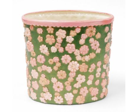 A 1960's/70's ceramic planter, later painted on green ground with pink flowers and pink border, unmarked, 25cm high, 26cm dia