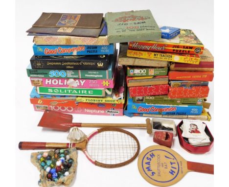 Various vintage toys, games and jigsaws, comprising ping pong bat, shuttlecock and bat, miniature spade, rabbit playing cards