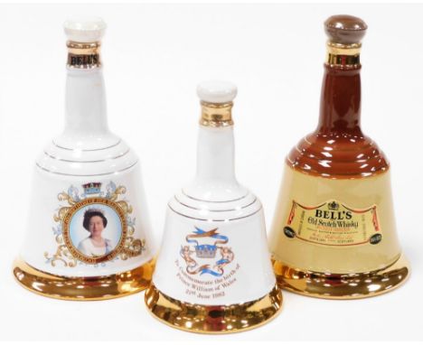 Three Bells scotch whisky decanters, to include a commemorative porcelain decanter 50cl, and two 75cl bottles. (3)