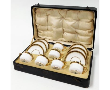 A Royal Doulton tea service, white design with gilt chequered borders, stamped Royal Doulton and numbered WB7092 E5060, compr
