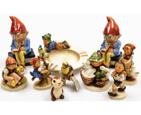 A group of Goebel Hummel figures, to include a pair of gnome decanter bookends, children figures, rabbit, bird on a branch, p