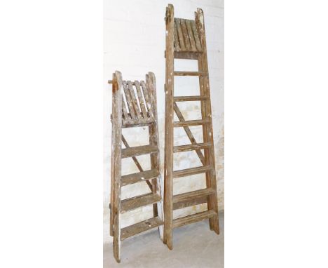 A 20thC vintage wooden folding step ladder, 215cm high and another smaller. (2, AF)