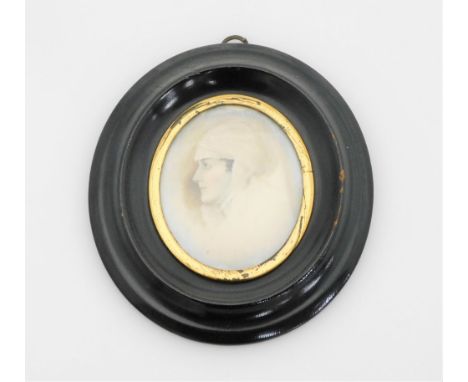 An early 19thC portrait miniature, depicting a maiden in headdress, painted on ivory, 5.5cm x 5cm, in a gilt surround, in a b