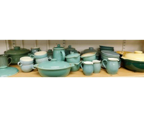 A Denby part dinner service, mainly in turquoise colouring, comprising cups, saucers, side plates, oven ware dishes, teapot, 