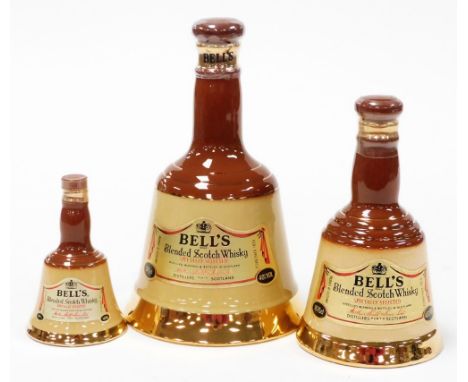A group of three graduated Bells scotch whisky ceramic decanters, to include 37.5cl, 18.75cl and another smaller example. (3)