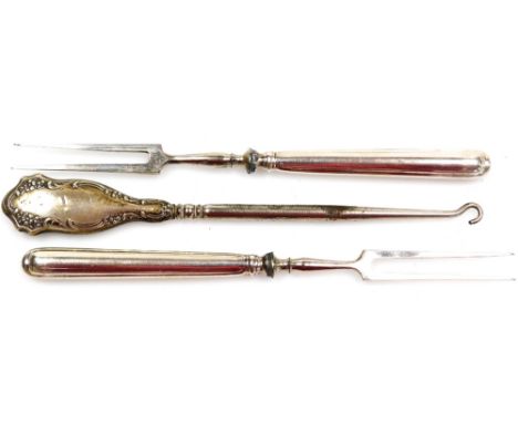 Two silver plated handled prongs, and a Victorian silver plate foliate scroll button hook. (3)