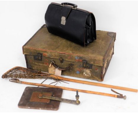 A canvas travel trunk, Victorian bamboo grab picker, lacrosse racket, briefcase, and winding mechanism. (5)