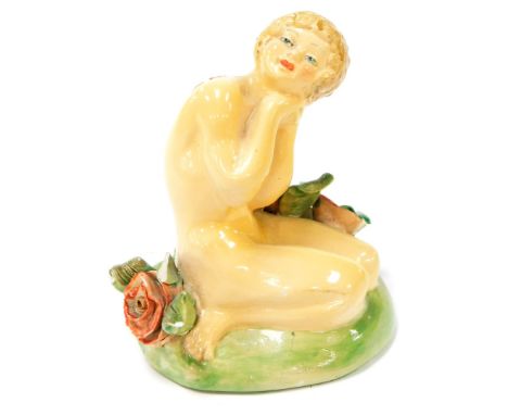 A Wade porcelain figure of a lady, in nude in the flower garden, with black Wade stamp to underside and red Made in England s