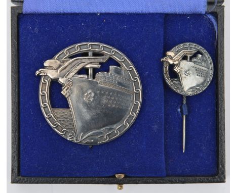 A Third Reich Blockade Breaker’s bade, by A.G.M u K (as Beadle 137 but flat type pin), with its miniature stick pin, in their
