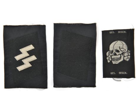 A pair of Third Reich SS woven collar patches, consisting of a blank patch and a basic SS runes patch, uncut on sections of b