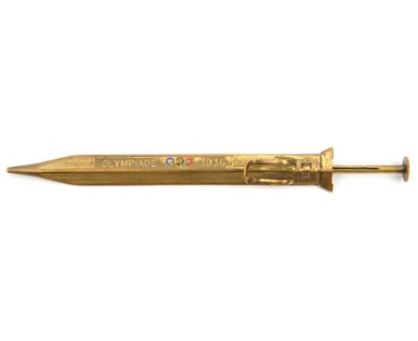 A German souvenir gilt brass propelling pencil for the 1936 Berlin Olympic Games, 4½” overall of shallow diamond section with
