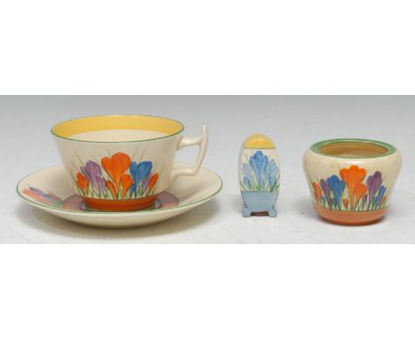 A Clarice Cliff Crocus pattern teacup and saucer, brightly painted with blue, orange and purple crocuses, banded in tan, prin