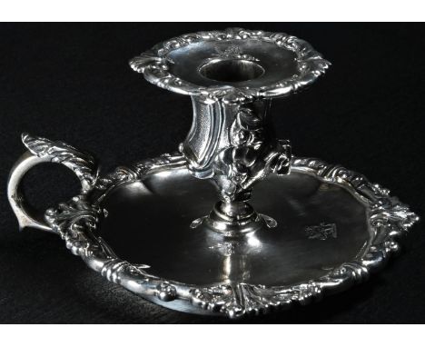 A William IV Rococo Revival silver chamber stick, detachable nozzle, acanthus-capped scroll handle, dished base, leafy scroll