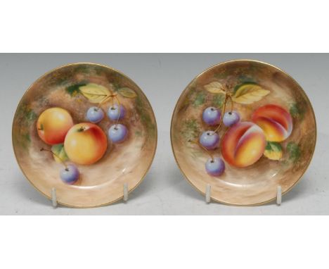 Two  Royal Worcester circular pin dishes, painted by Roberts, signed, with ripe fruit on a mossy bank, 11cm diam, printed mar