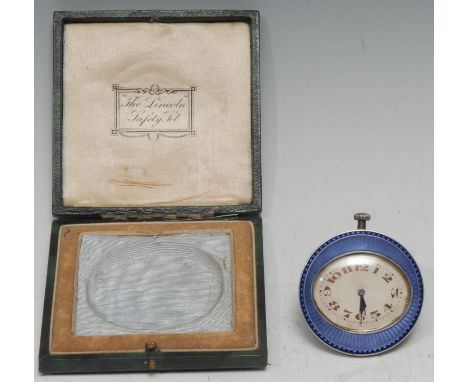 An early 20th century Continental guilloché enamel and silver boudoir easel timepiece, of small proportions, oval silvered di