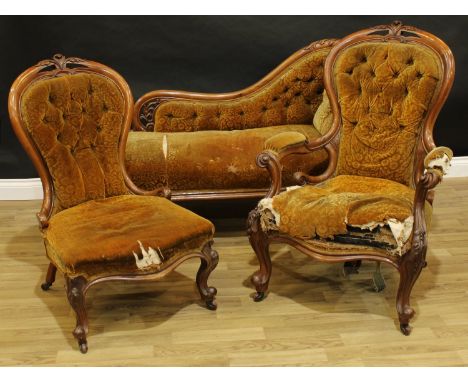 A Victorian walnut drawing room suite, comprising a chaise longue, an armchair and side chair, shaped cresting rails carved w