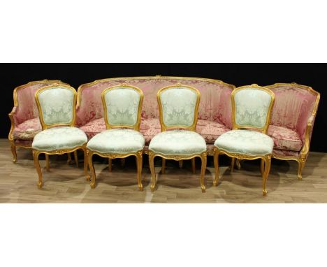 A Louis XV style giltwood seven piece drawing room suite, comprising a sofa, a pair of armchairs and four side chairs, flower