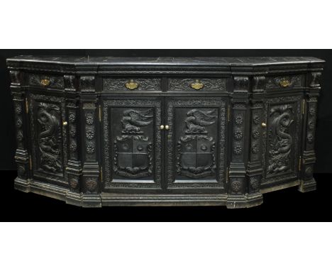 A 19th century oak canted rectangular buffet side cabinet, slightly oversailing top above an arrangement of cedar lined drawe