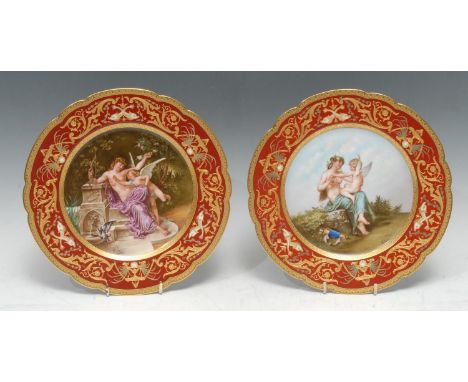 A fine pair of Vienna porcelain shaped circular cabinet plates, signed by Deluc, each decorated to the centre with Nymphe Lut