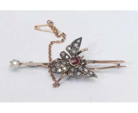 A Victorian diamond and ruby butterfly bar brooch, central oval deep red ruby approx 0.10ct, within triangular V winged body 