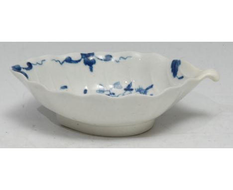 A Worcester scalloped circular dish, twig handle,  moulded in relief,  painted in blue under glaze with leaves and insects, 1