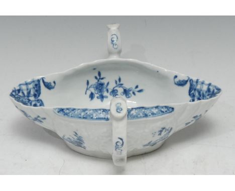A Worcester two handled double lipped sauceboat,  painted with a Chinese landscape in under glaze blue,  19cm wide, workman?s