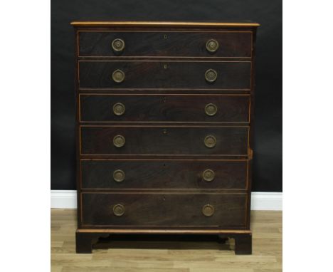 A 19th century laburnum chest, rectangular top above three long double-depth drawers, brass ring handles, outlined throughout