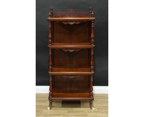 A Victorian walnut four-tier whatnot, pierced three-quarter gallery, panelled back, shaped aprons carved with demilune patera