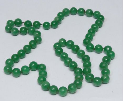 A green stone jade effect globular bead single strand necklace, bead diameter approx 12mm, 82cm long 