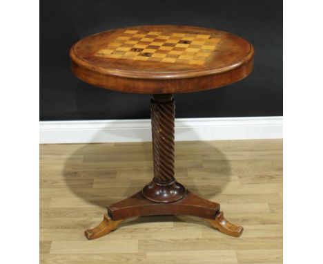 A 19th century mahogany circular pedestal games table, moulded tilting top inlaid for chess, above a deep frieze, spirally tu