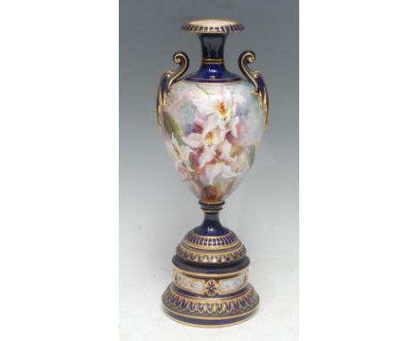 A Royal Worcester two handled pedestal ovoid vase,   painted probably by Frank Roberts, with with bearded irises, cobalt blue